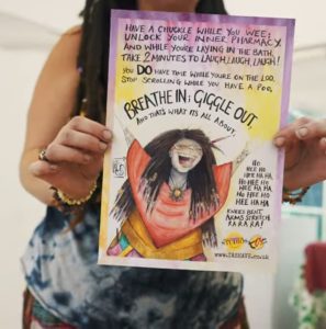 Image of Laughter Loo Poster from Laughter Yoga session at a festival.